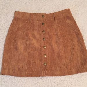 Corduroy orange mini skirts with buttons